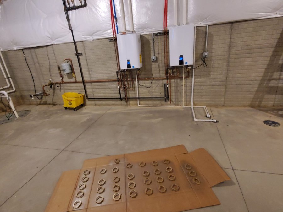 JD's Plumbing technician installing a water heater in an Avon, Ohio home